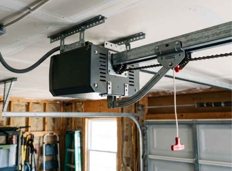 Chain-driven garage door opener mechanism with ceiling-mounted motor and rail.